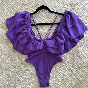 Like new- Zara swim/bodysuit. Bright purple with large ruffle & v neck strap